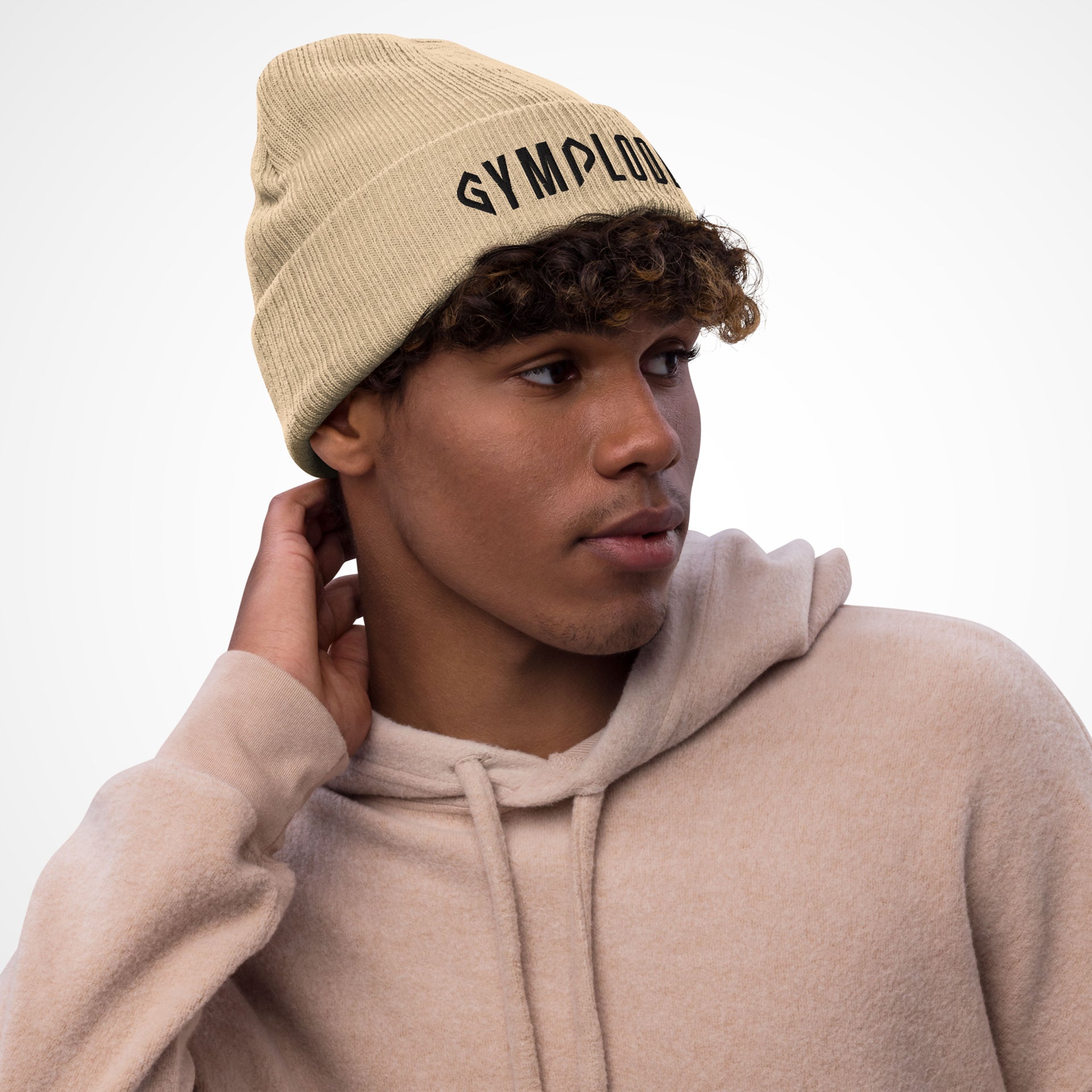Beige coming soon Gymplode beanie hat with black male model