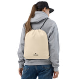 Blush coral lightweight drawstring bag with Gymplode dual mark imprint worn as backpack by female model