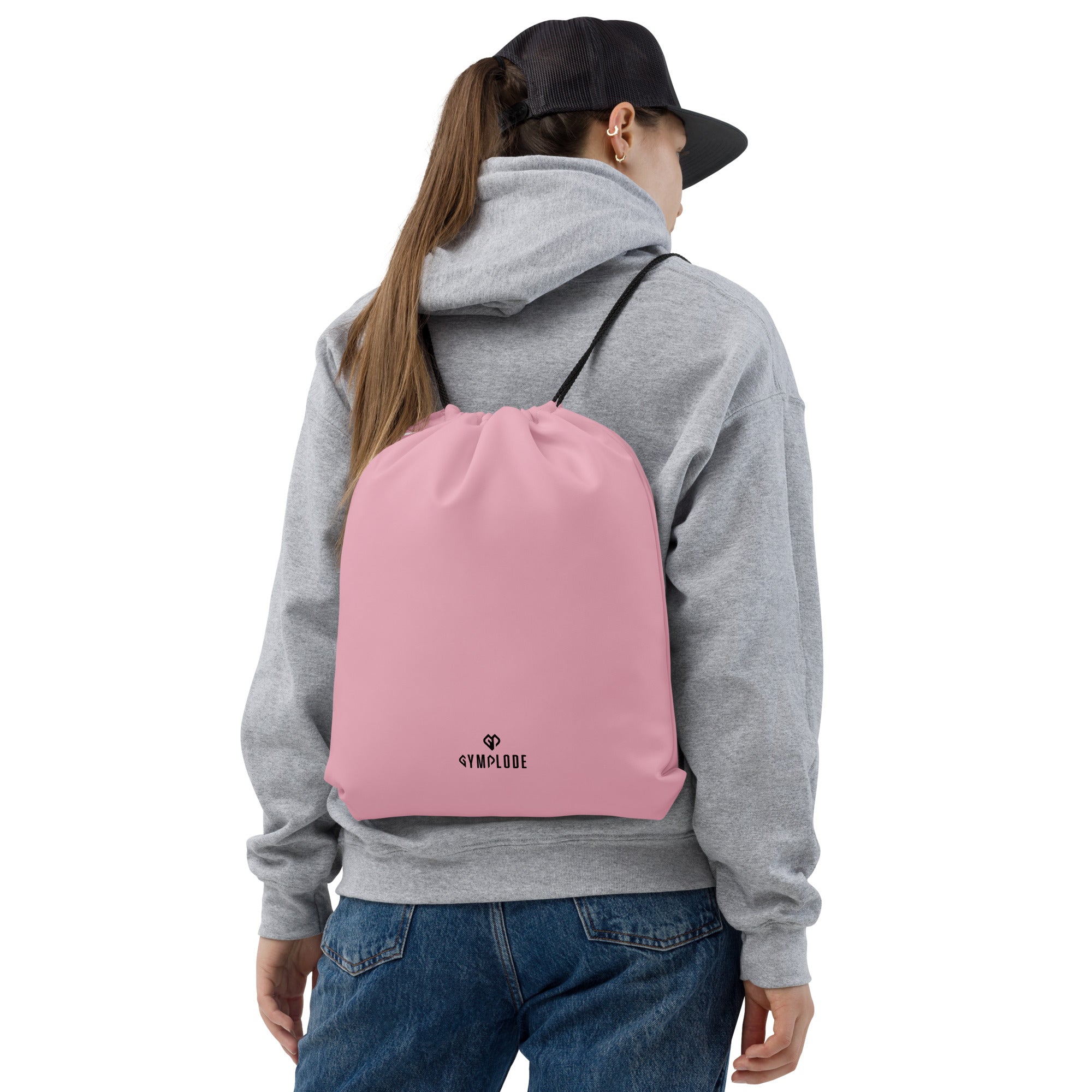 Candy pink lightweight drawstring bag with Gymplode dual mark imprint worn as backpack by female model