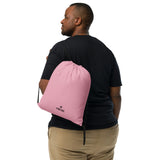 Candy pink lightweight drawstring bag with Gymplode dual mark imprint worn as backpack by male model