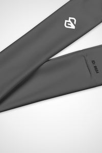 Close up view of Gymplode icon logo on carbon grey headband