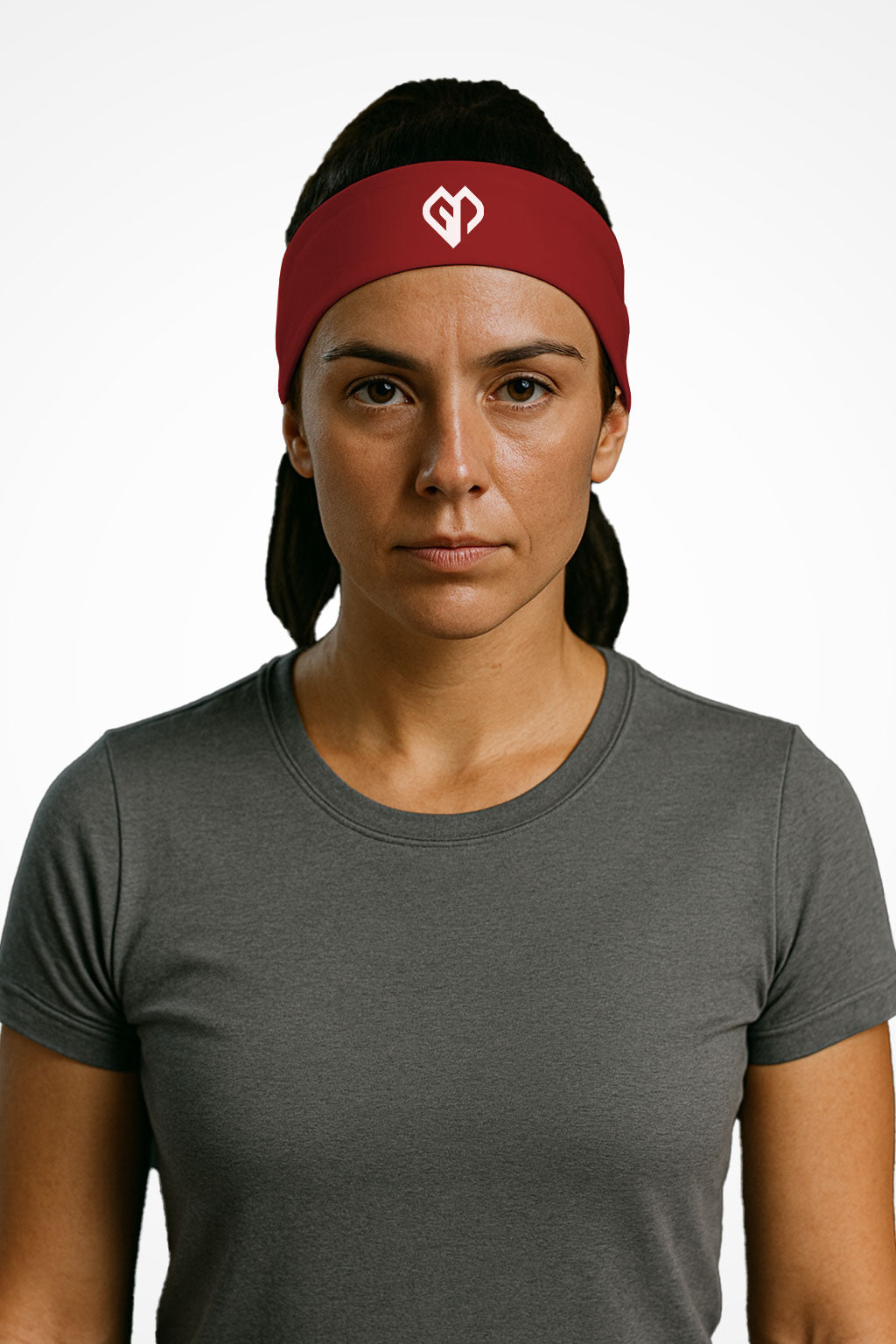 Cherry red Gymplode headband with icon logo, worn by female model