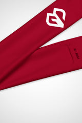 Close-up view of Gymplode icon logo on cherry red headband