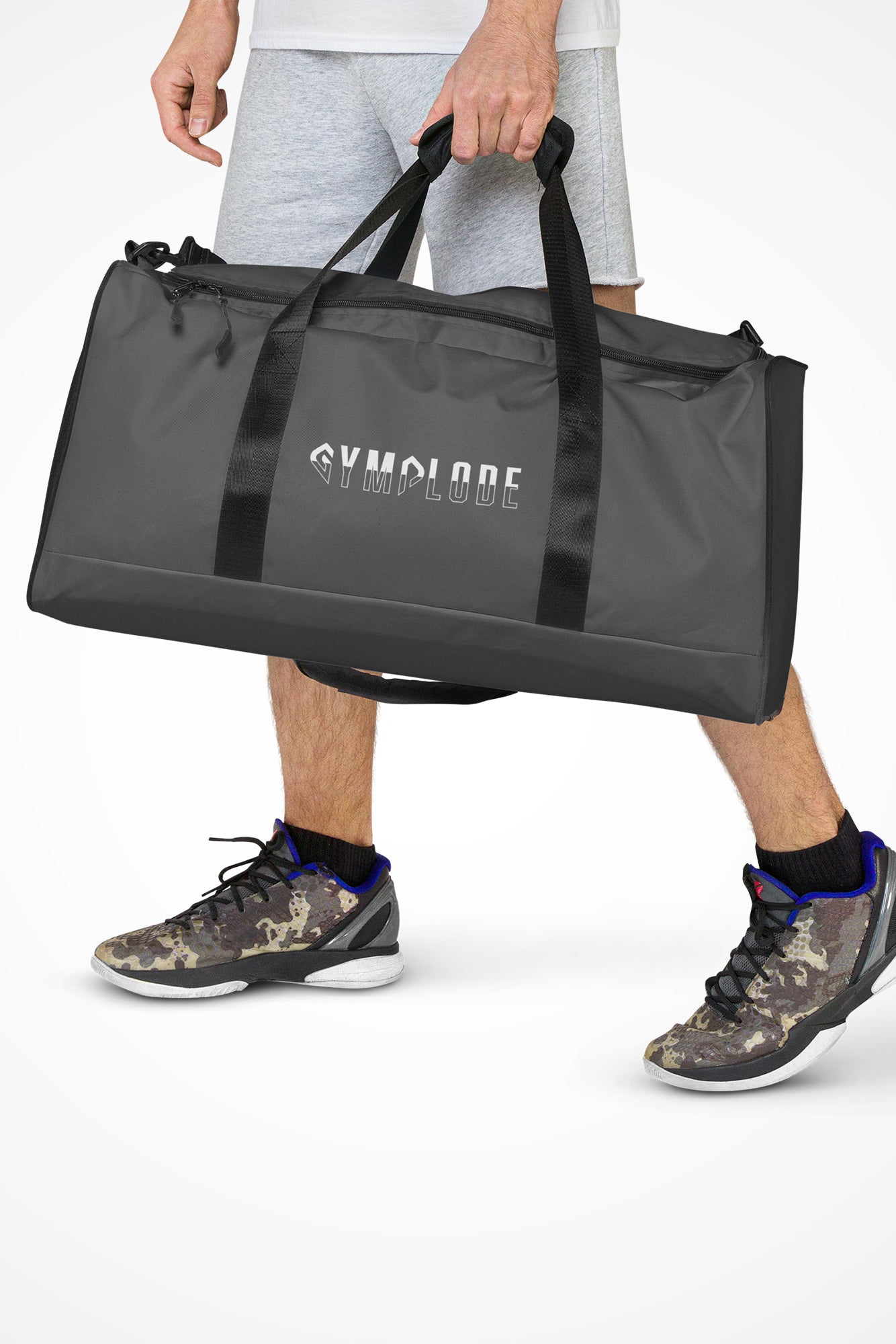 Dusky grey square end Gymplode duffle bag with signature logo, front view with model