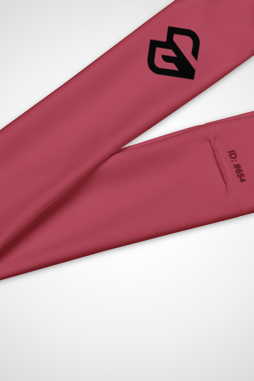 Close up view of Gymplode icon logo on hippie pink headband