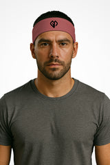 Hippie pink Gymplode headband with icon logo, worn by male model