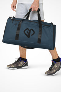 Indigo blue square end Gymplode duffle bag with icon logo, front view with model