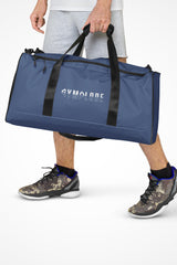 Kashmir blue square end Gymplode duffle bag with signature logo, front view with model