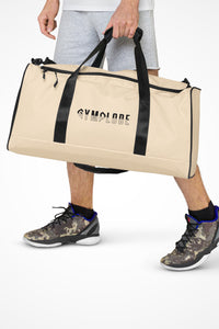 Light coral square end Gymplode duffle bag with signature logo, front view with model