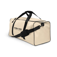 Light coral square end Gymplode duffle bag with signature logo, left front view