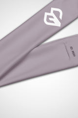 Close up view of Gymplode icon logo on lilac grey headband