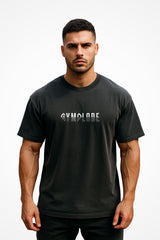 Mens Oversized Faded Streetwear t-shirt with Gymplode signature logo, front view with model