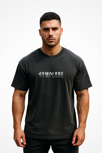 Mens Oversized Faded Streetwear t-shirt with Gymplode signature logo, front view with model