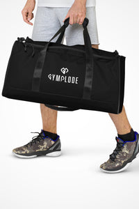 Midnight black square end Gymplode duffle bag with dual mark, front view with model