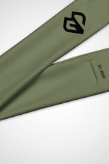 Close up view of Gymplode icon logo on moss green headband