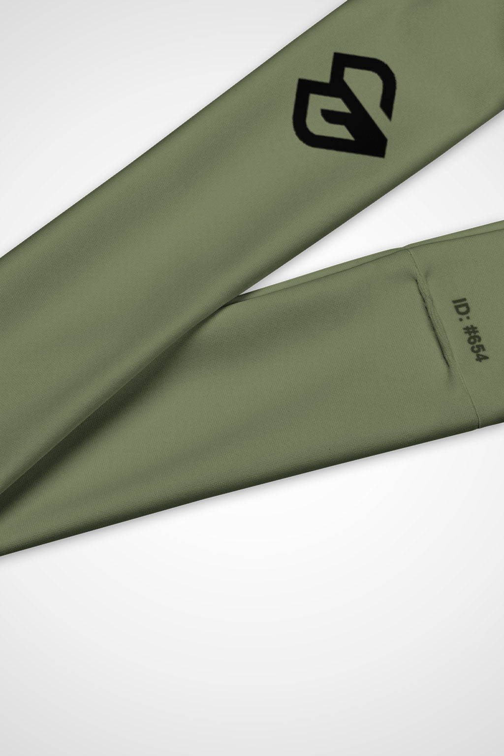 Close up view of Gymplode icon logo on moss green headband