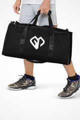 Onyx black square end Gymplode duffle bag with icon logo, front view with model