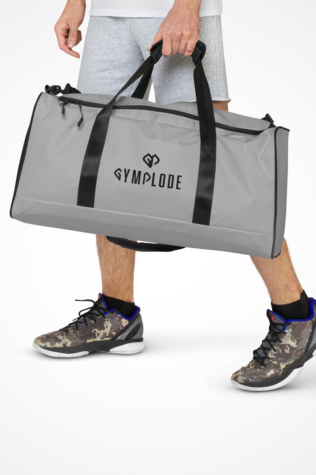 Pale grey square end Gymplode duffle bag with dual mark, front view with model