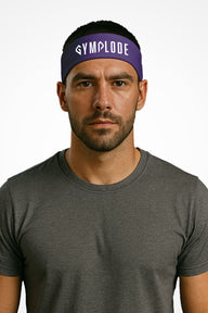 Purple Gymplode headband with signature logo, worn by male model