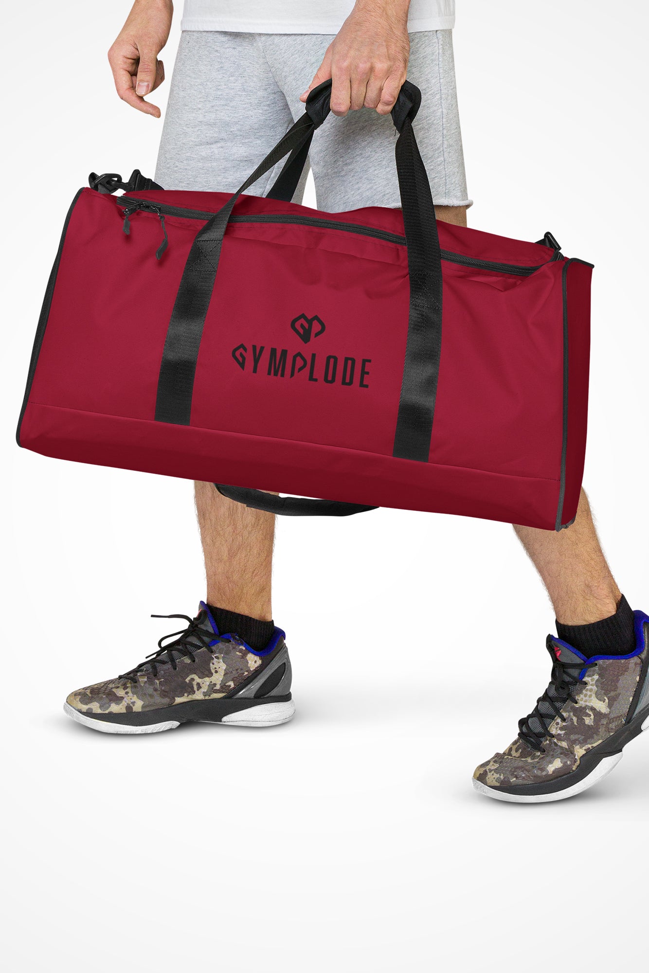 Ruby red square end Gymplode duffle bag with dual mark, front view with model