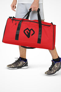 Signal red square end Gymplode duffle bag with icon logo, front view with model