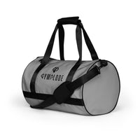 Smoke grey rounded end Gymplode duffle bag with dual mark, left front view