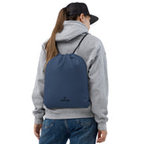 Storm blue lightweight drawstring bag with Gymplode dual mark imprint worn as backpack by female model