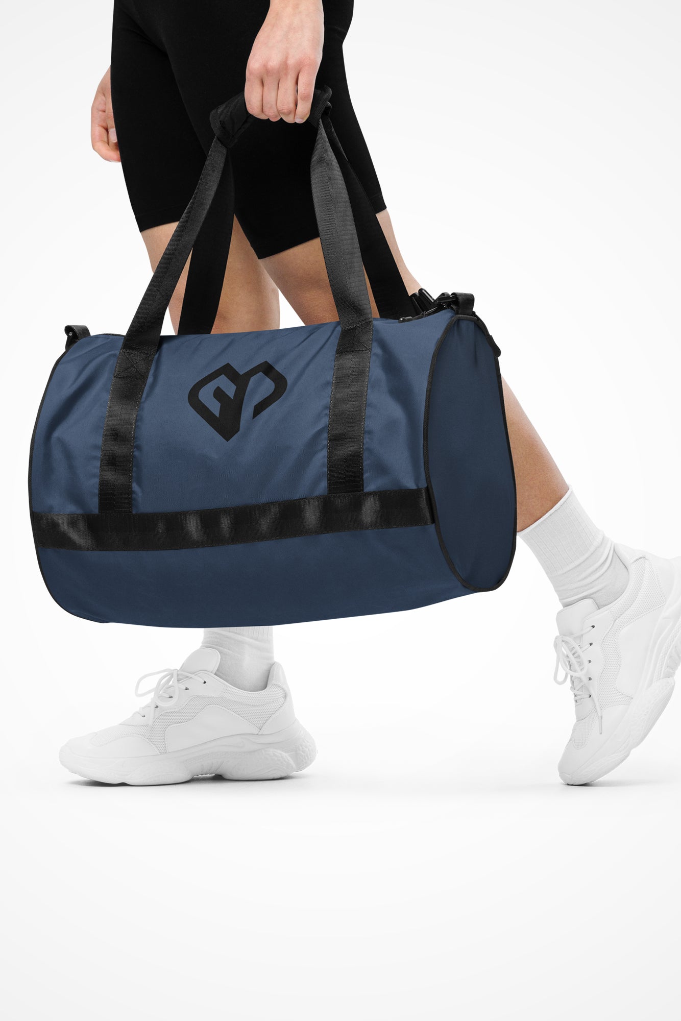 Storm blue rounded end Gymplode duffle bag with icon logo, front view with model