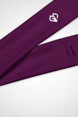 Close up view of Gymplode icon logo on Tyrian purple headband