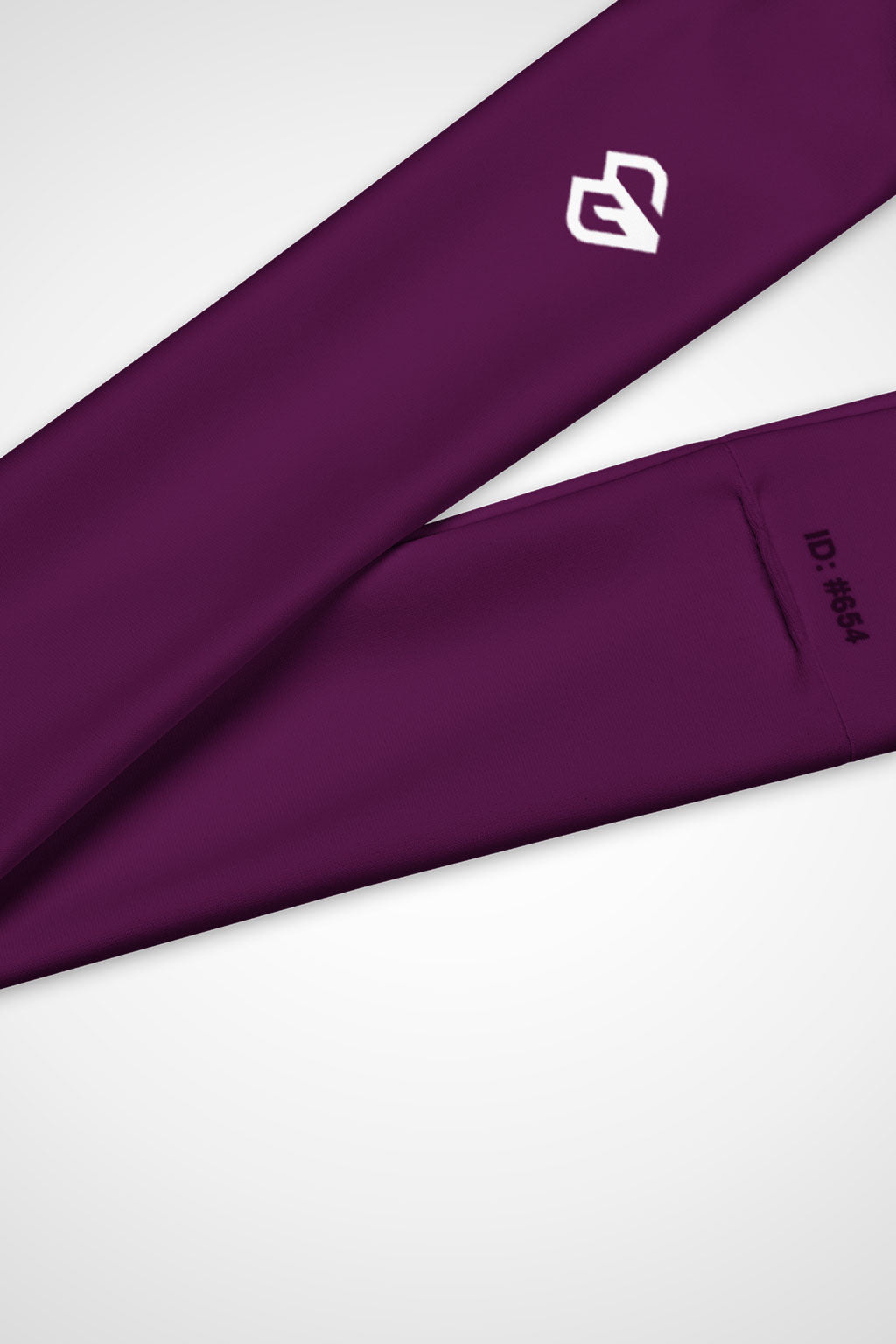 Close up view of Gymplode icon logo on Tyrian purple headband