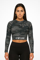 Womens Ashen long sleeve sports crop top with Gymplode sig logo, front view with model