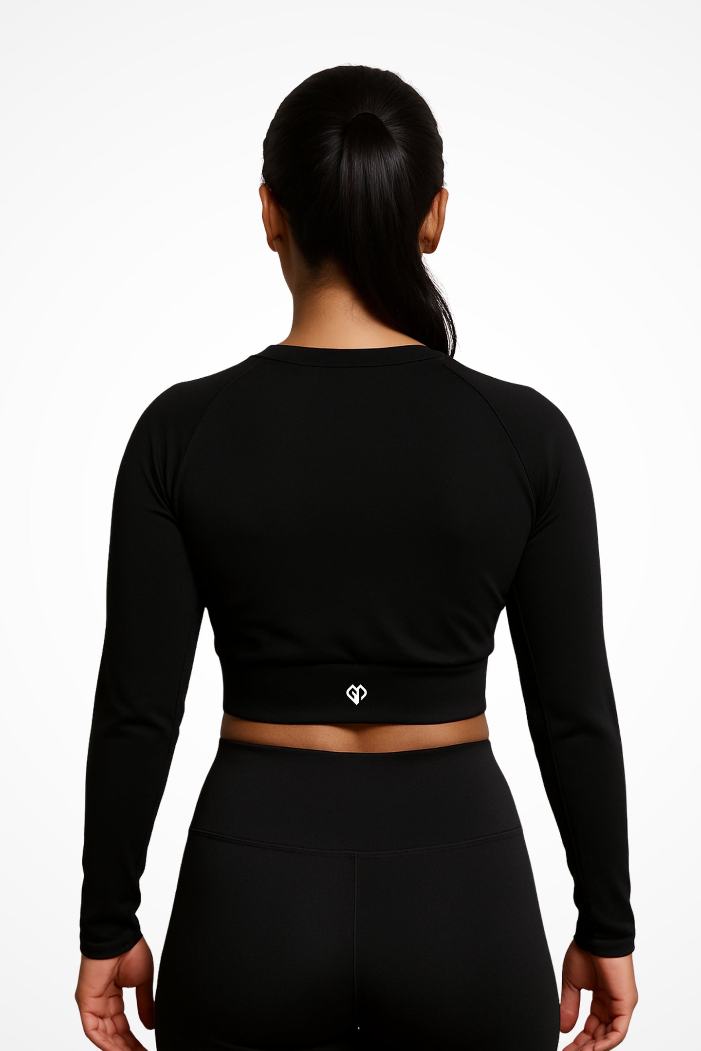 Womens Black long sleeve sports crop top with Gymplode icon logo, back view with model