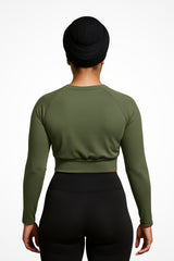 Womens Gymplode Khaki long sleeve sports crop top with no print, back view with model