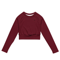Womens Rouge long sleeve sports crop top with Gymplode icon logo, front view