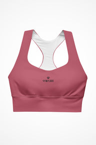 Womens hippie pink longline sports bra with Gymplode dual mark logo, front view