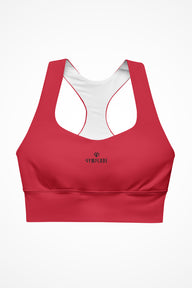 Womens red longline sports bra with Gymplode dual mark logo, front view