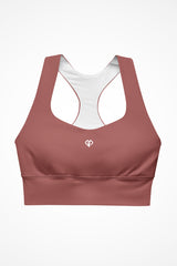 Womens rust clay longline sports bra with Gymplode icon logo, front view