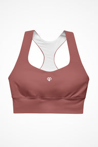 Womens rust clay longline sports bra with Gymplode icon logo, front view